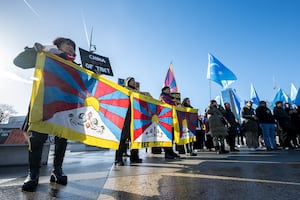 Tibetan and Uyghur activists protest outside the UN offices in Geneva, Switzerland, during a review of China's human rights record by the U.N. Human Rights Council, Jan. 23, 2024.