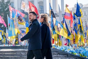 Ukrainian President Volodymyr Zelensky (L) and his wife, Ukraine's First Lady Olena Zelenska are pictured at Maidian Square in Kyiv before a summit of European leaders on the third anniversary of the Russian invasion, on Feb. 24, 2025.