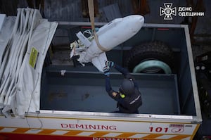 A bomb squad member loads a part of a missile on a truck after a recent Russian missile attack, amid Russia's attack on Ukraine, in Odesa, Ukraine Nov. 1, 2024.