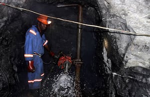 A Zimbabwean miner works underground at Metallon Gold mine in Shamva about 80 km (50 miles) north of the capital Hararre, June 14, 2011.