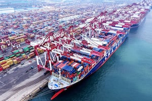 Container ships are berthed at the port in Qingdao, in China's eastern Shandong province on March 4, 2025. China set an ambitious annual growth target of around five percent on March 5 vowing to make domestic demand its main economic driver as an escalating trade war with the United States hit Beijing's exports.