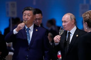 Russian President Vladimir Putin and Chinese President Xi Jinping hold glasses during a festive reception of the BRICS summit in Kazan on Oct. 23, 2024.