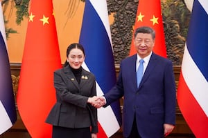 Thailand's Prime Minister Paetongtarn Shinawatra shakes hand with Chinese President Xi Jinping in Beijing, China, Feb. 6, 2025.