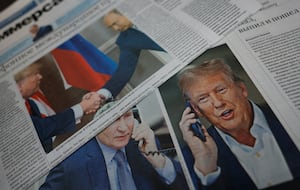 Daily newspapers with covers, dedicated to the recent phone call of Russian President Vladimir Putin and U.S. President Donald Trump, are laid out at a newsstand in a street in Moscow, Russia, Feb. 13, 2025.