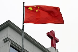 A Chinese flag flies below a cross on a Christian church in Pingtan, in China’s southeast Fujian province, Jan. 15, 2024.