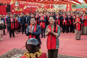 Myanmar's military chief Min Aung Hlaing (L) and China's ambassador to Myanmar Ma Jia (R) take part in a ceremony on the eve of the Lunar New Year, in Yangon on Jan. 25, 2025.